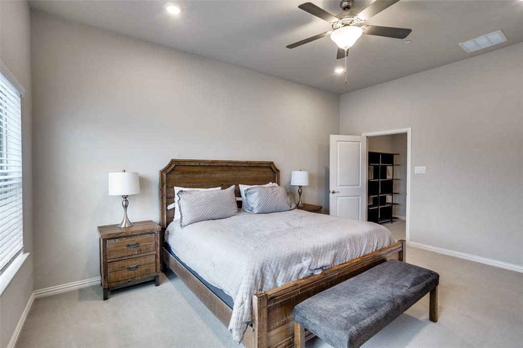 5622 Niagara Road The Colony, TX 75056 - Photo 17 of 28 a bedroom with a bed and ceiling fan