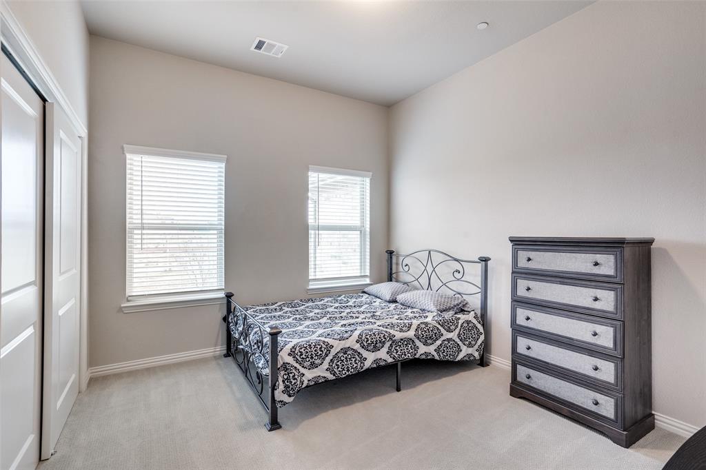 5622 Niagara Road The Colony, TX 75056 - Photo 23 of 28 a bedroom with a bed and a window