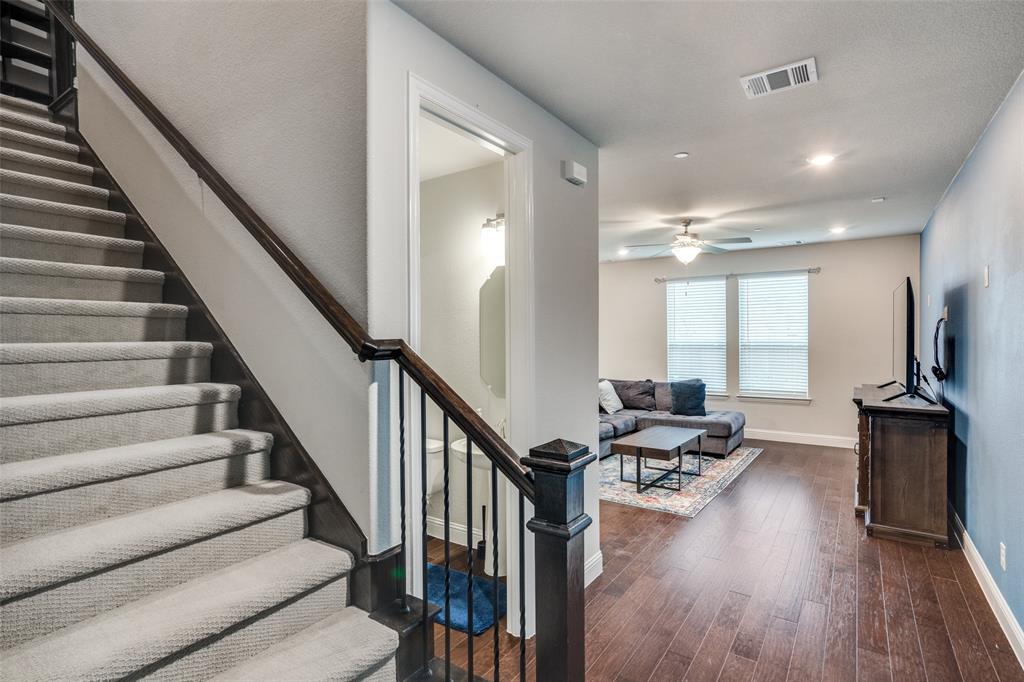 5622 Niagara Road The Colony, TX 75056 - Photo 4 of 28 a view of a livingroom with furniture staircase and a large window