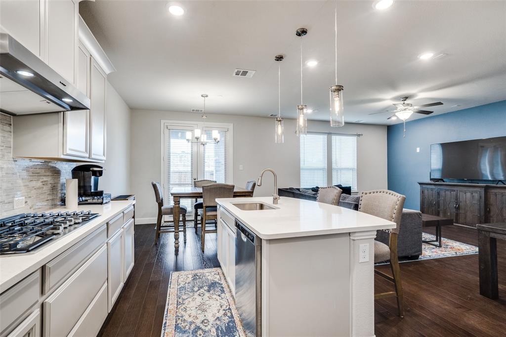 5622 Niagara Road The Colony, TX 75056 - Photo 10 of 28 a large kitchen with a table and chairs