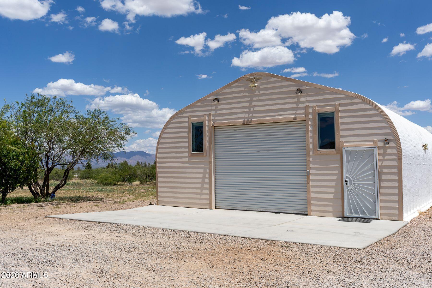 10847 South Kings Ranch Road Hereford, AZ 85615 - Photo 1 of 49 a view of a house with a large space and a large tree