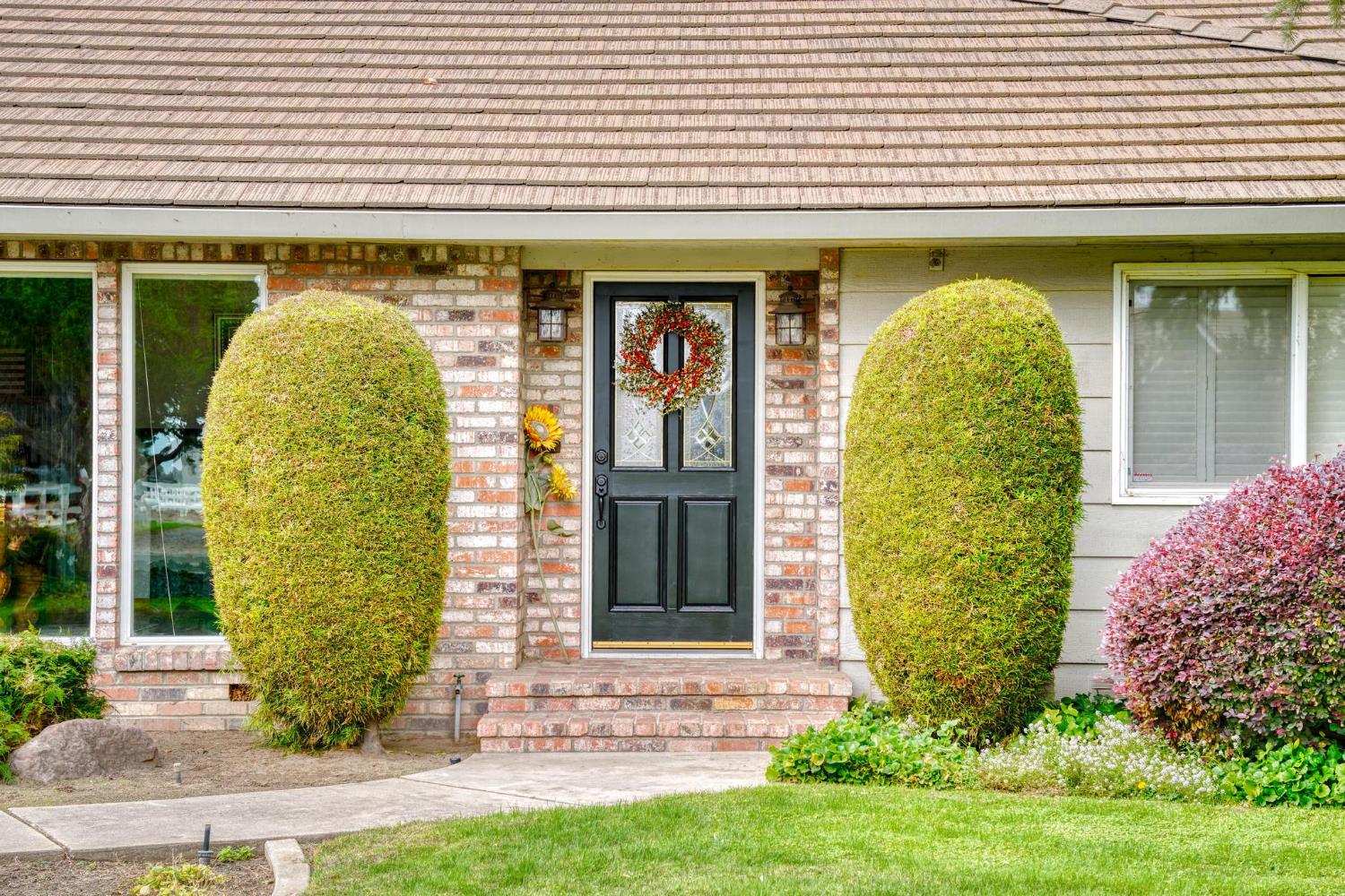13791 Castle Road Manteca, CA 95336 - Photo 11 of 96 doorway to property featuring brick siding
