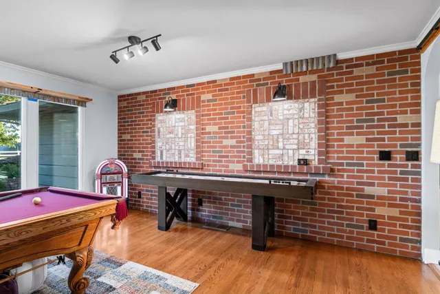 a bathroom with a bathtub and next to a window