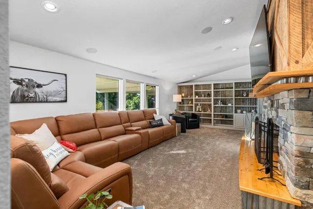 a view of a kitchen with refrigerator and cabinets