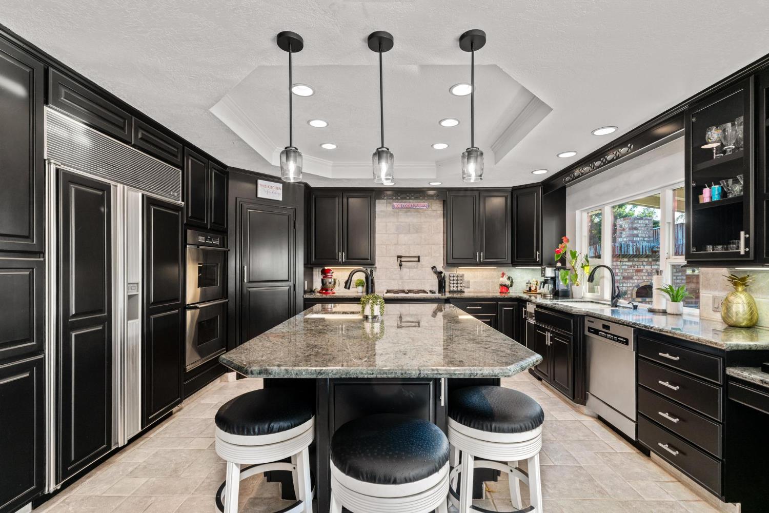 13791 Castle Road Manteca, CA 95336 - Photo 23 of 96 a kitchen with a table and chairs
