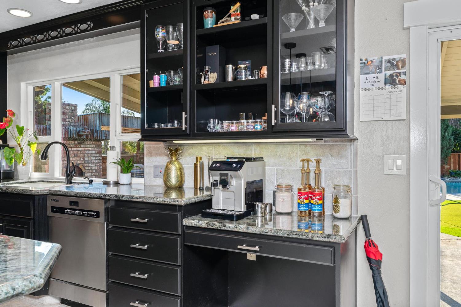 13791 Castle Road Manteca, CA 95336 - Photo 25 of 96 bar area with dark cabinetry, granite counters, decorative backsplash
