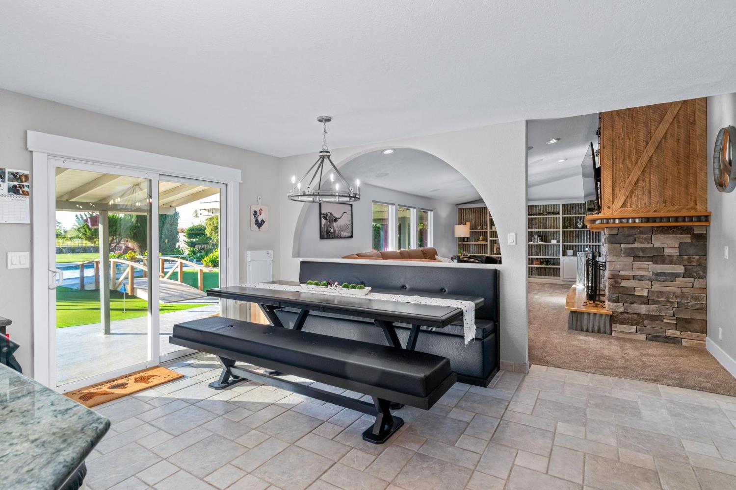 13791 Castle Road Manteca, CA 95336 - Photo 26 of 96 a living room with furniture a flat screen tv and a window
