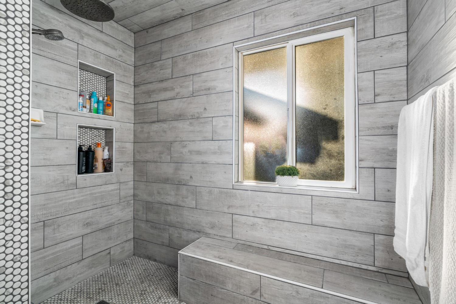 13791 Castle Road Manteca, CA 95336 - Photo 33 of 96 a bathroom with a bathtub and next to a window