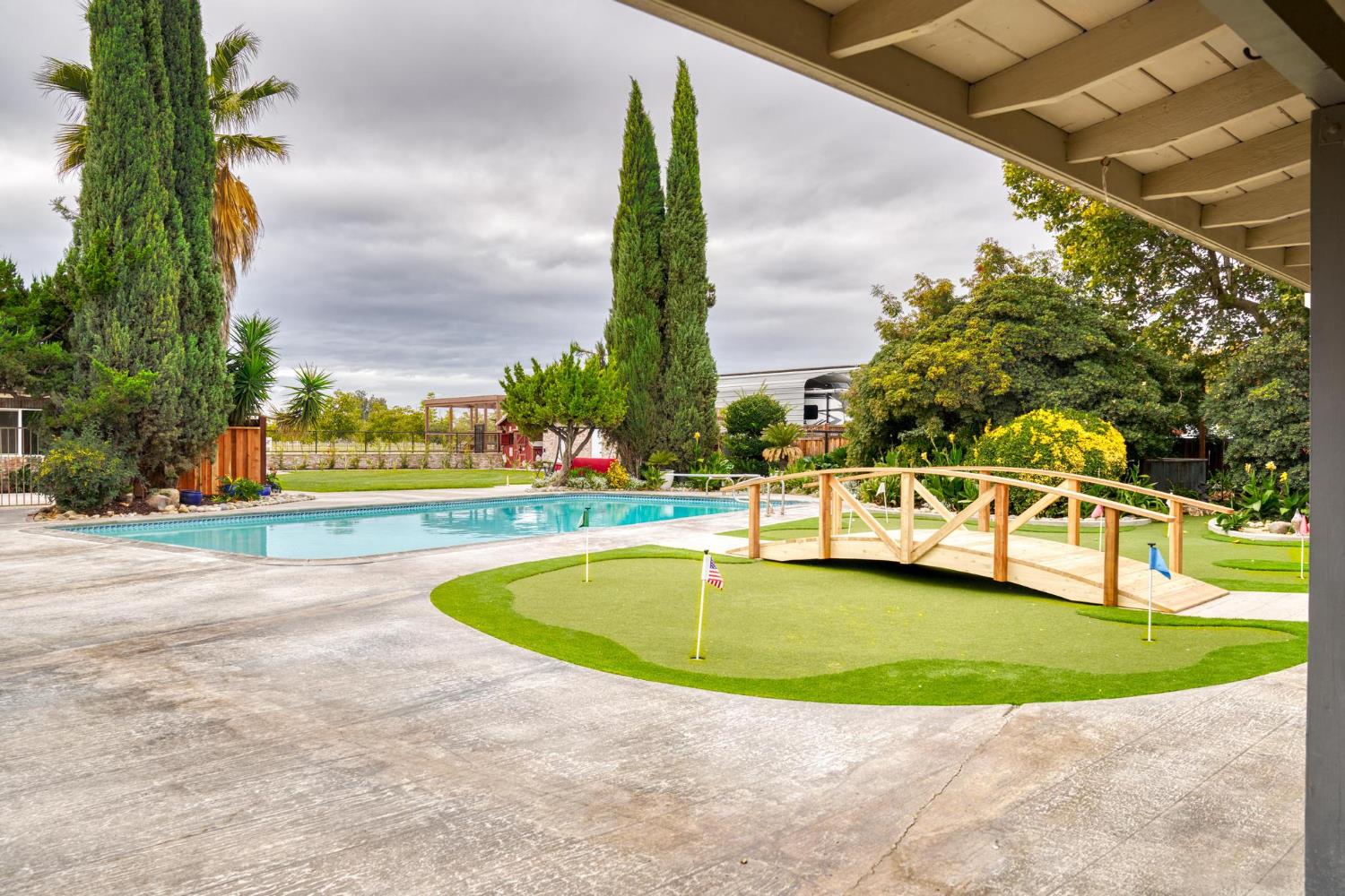 13791 Castle Road Manteca, CA 95336 - Photo 42 of 96 a view of a swimming pool with a yard