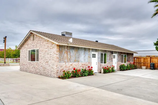 a front view of a house with a yard and a garage