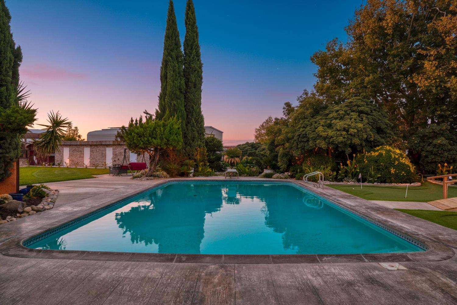 13791 Castle Road Manteca, CA 95336 - Photo 5 of 96 a view of a swimming pool with a yard