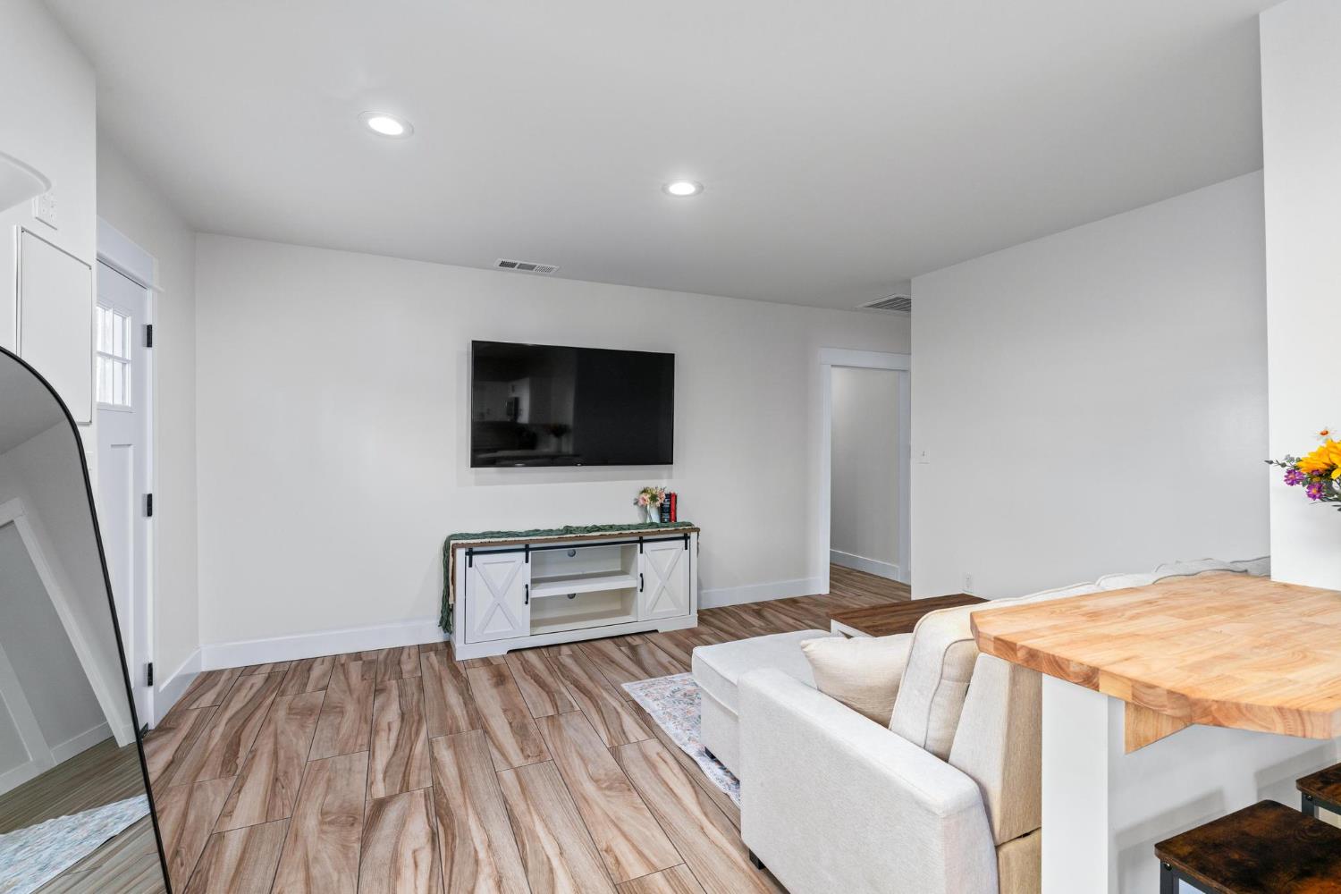 13791 Castle Road Manteca, CA 95336 - Photo 52 of 96 a living room with furniture and a flat screen tv