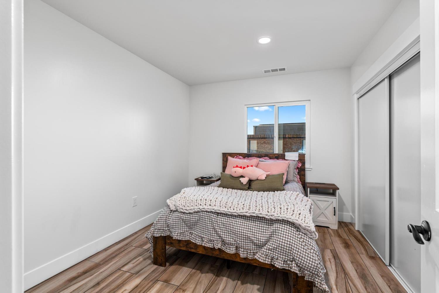 13791 Castle Road Manteca, CA 95336 - Photo 54 of 96 a bedroom with a bed and wooden floor