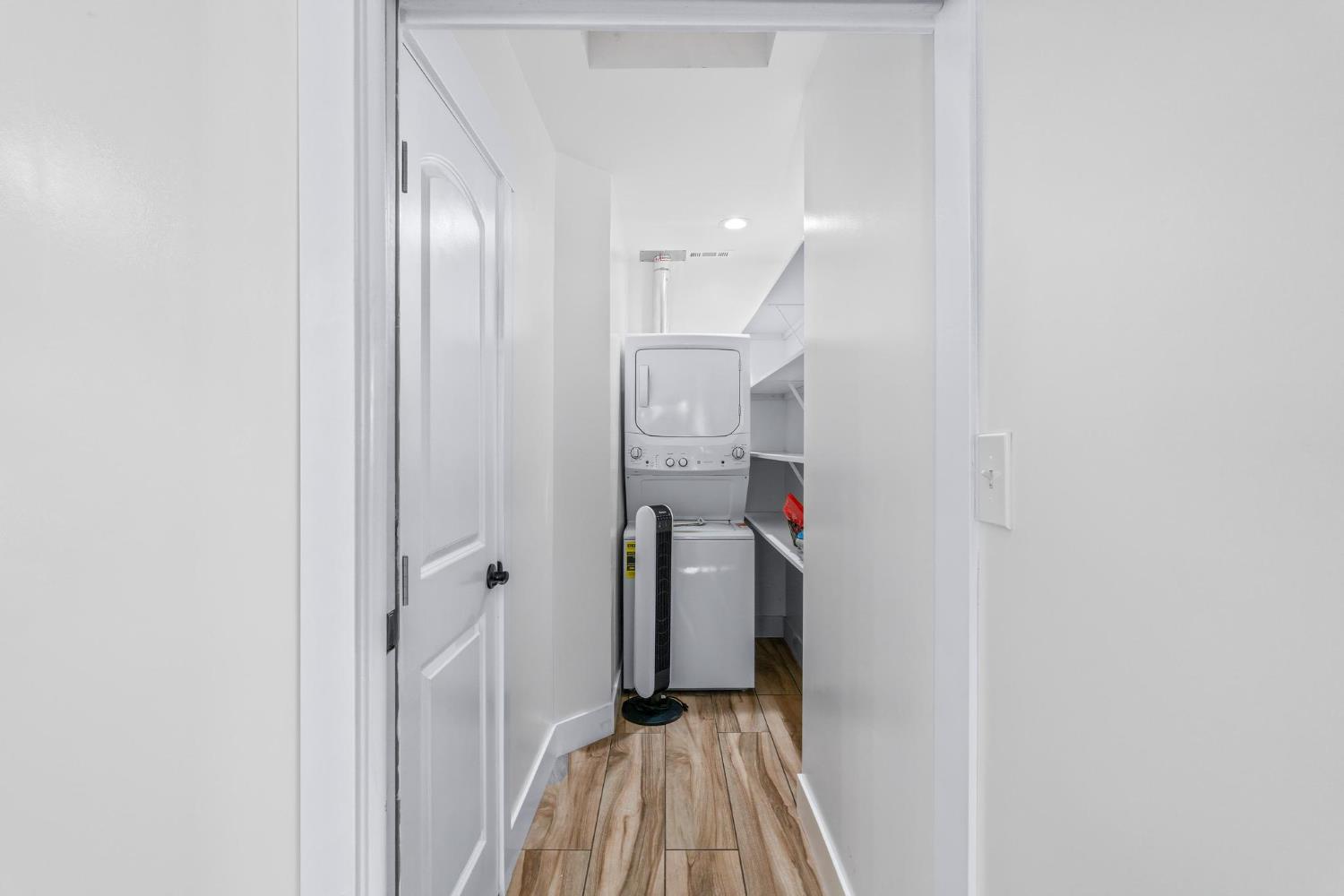 13791 Castle Road Manteca, CA 95336 - Photo 58 of 96 a view of a hallway with wooden floor and staircase