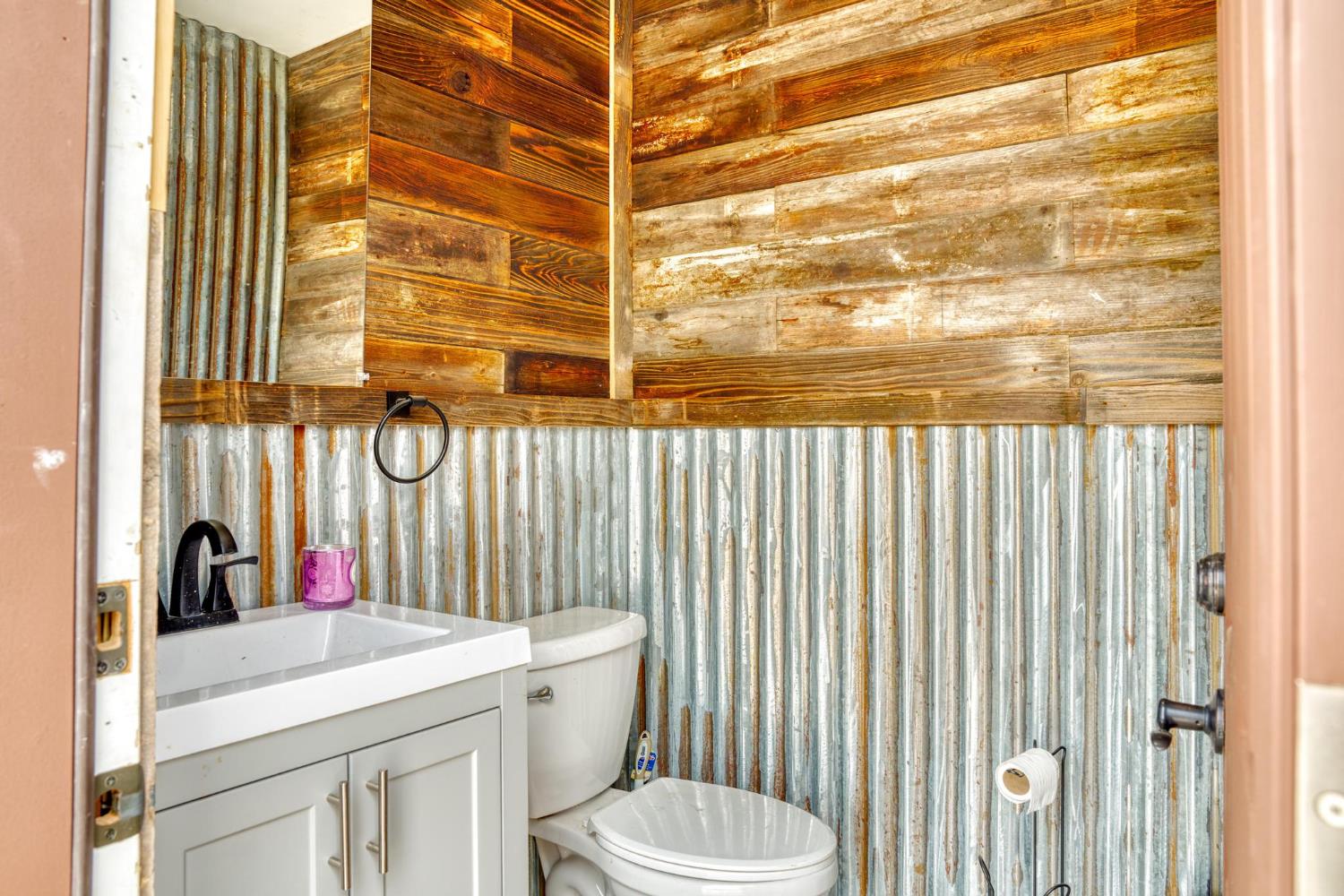 13791 Castle Road Manteca, CA 95336 - Photo 62 of 96 1/2 bathroom featuring vanity and toilet