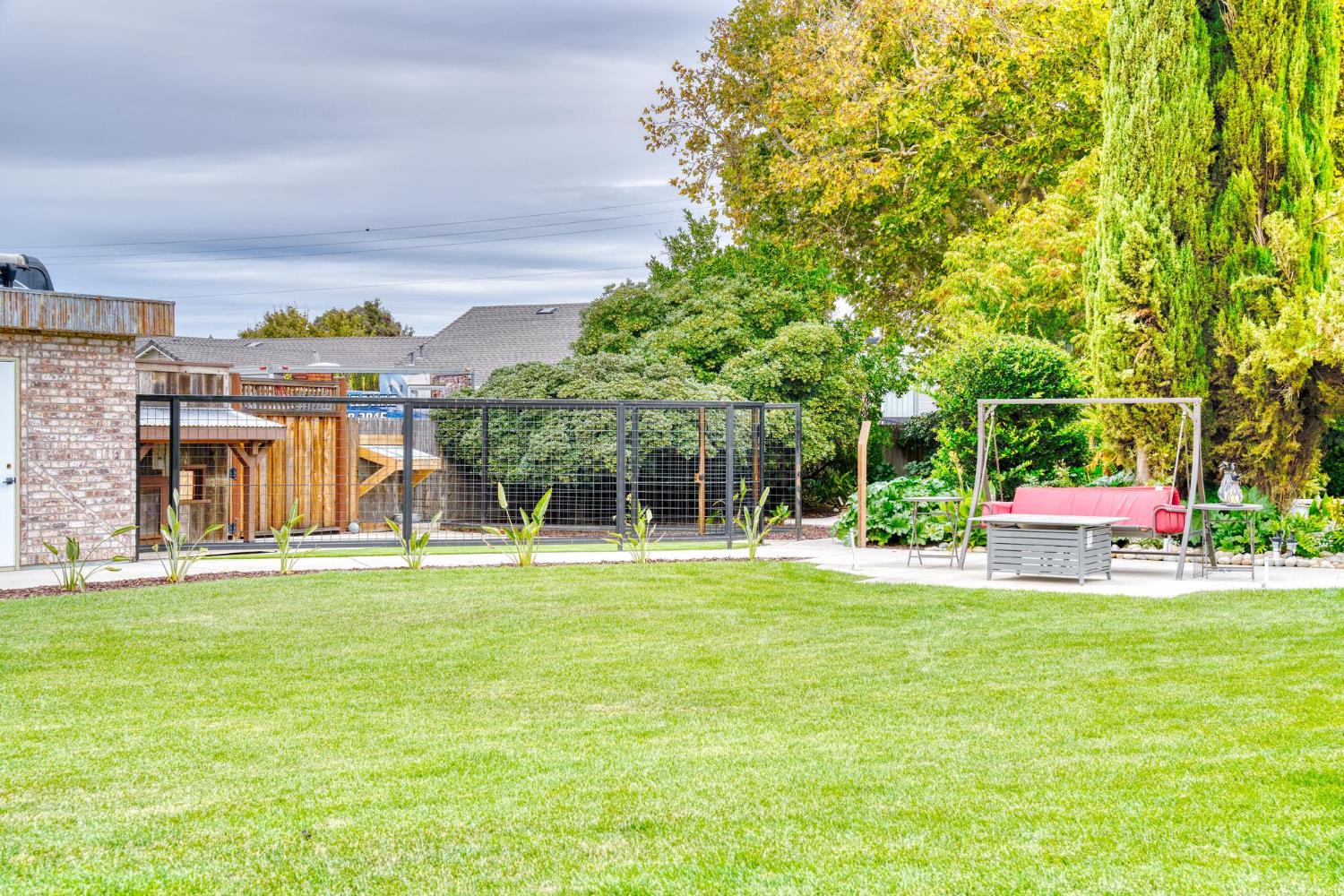 13791 Castle Road Manteca, CA 95336 - Photo 66 of 96 a view of a house with a big yard and large trees