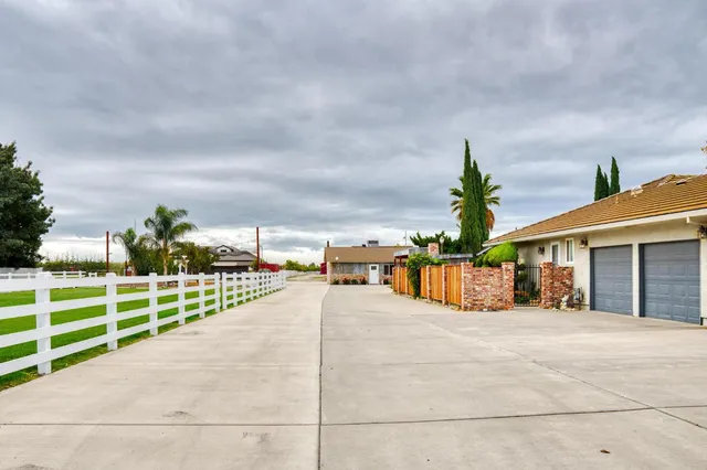 a living room with furniture a window and gym equipment