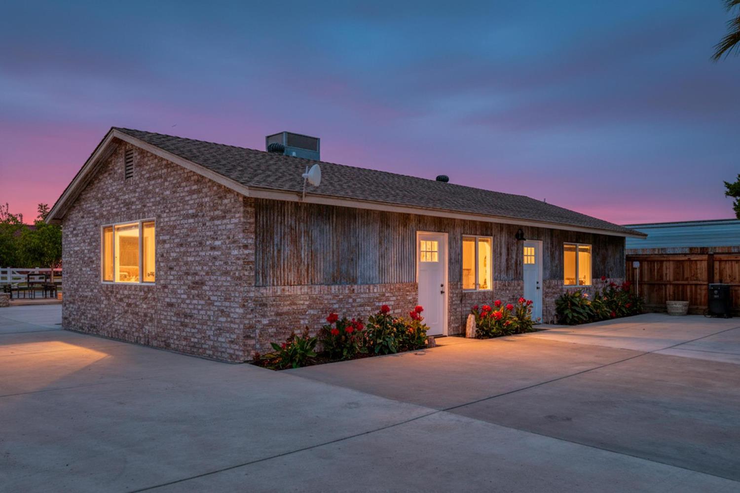 13791 Castle Road Manteca, CA 95336 - Photo 94 of 96 a front view of a house with a yard and a garage