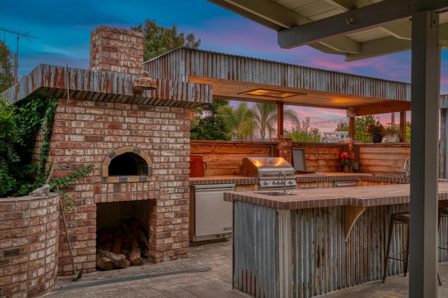13791 Castle Road Manteca, CA 95336 - Photo 95 of 96 a kitchen with stainless steel appliances granite countertop a stove and a fireplace