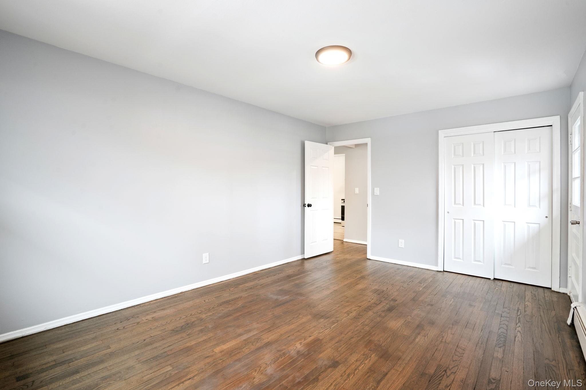 2710 South Road, Unit C6 Poughkeepsie, NY 12601 - Photo 13 of 19 a view of an empty room with wooden floor