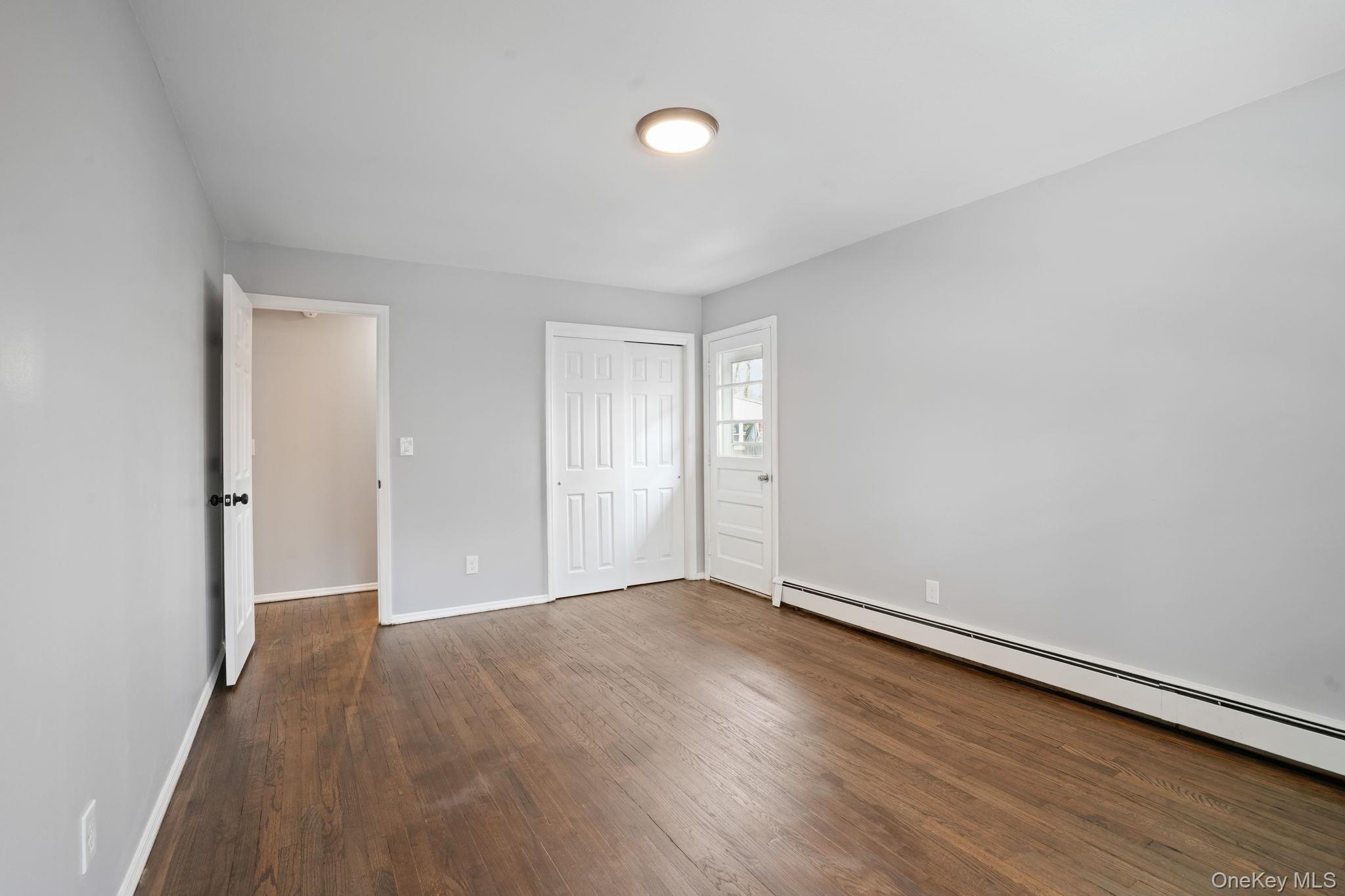 2710 South Road, Unit C6 Poughkeepsie, NY 12601 - Photo 14 of 19 a view of an empty room with wooden floor
