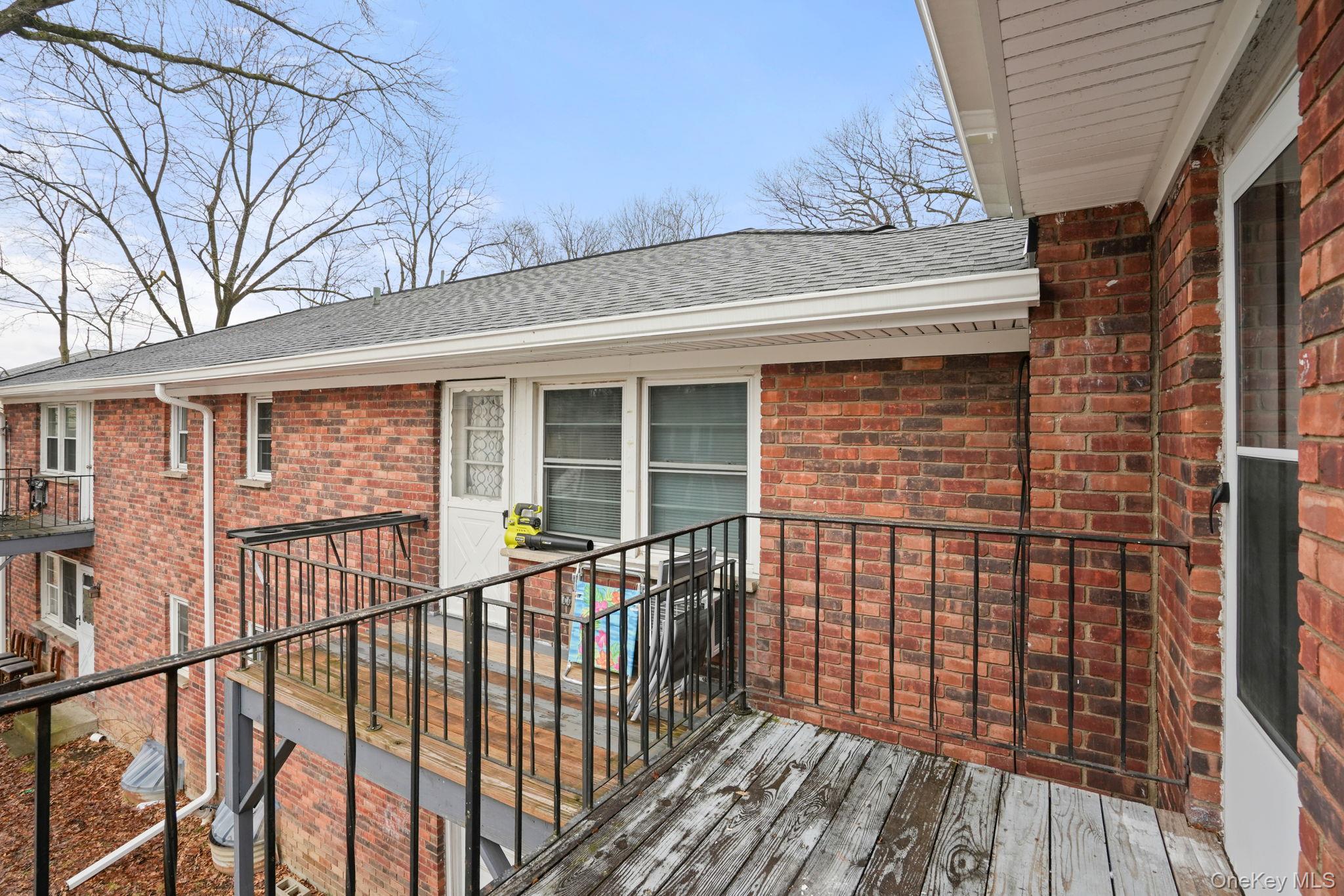 2710 South Road, Unit C6 Poughkeepsie, NY 12601 - Photo 17 of 19 a view of a brick house with large windows