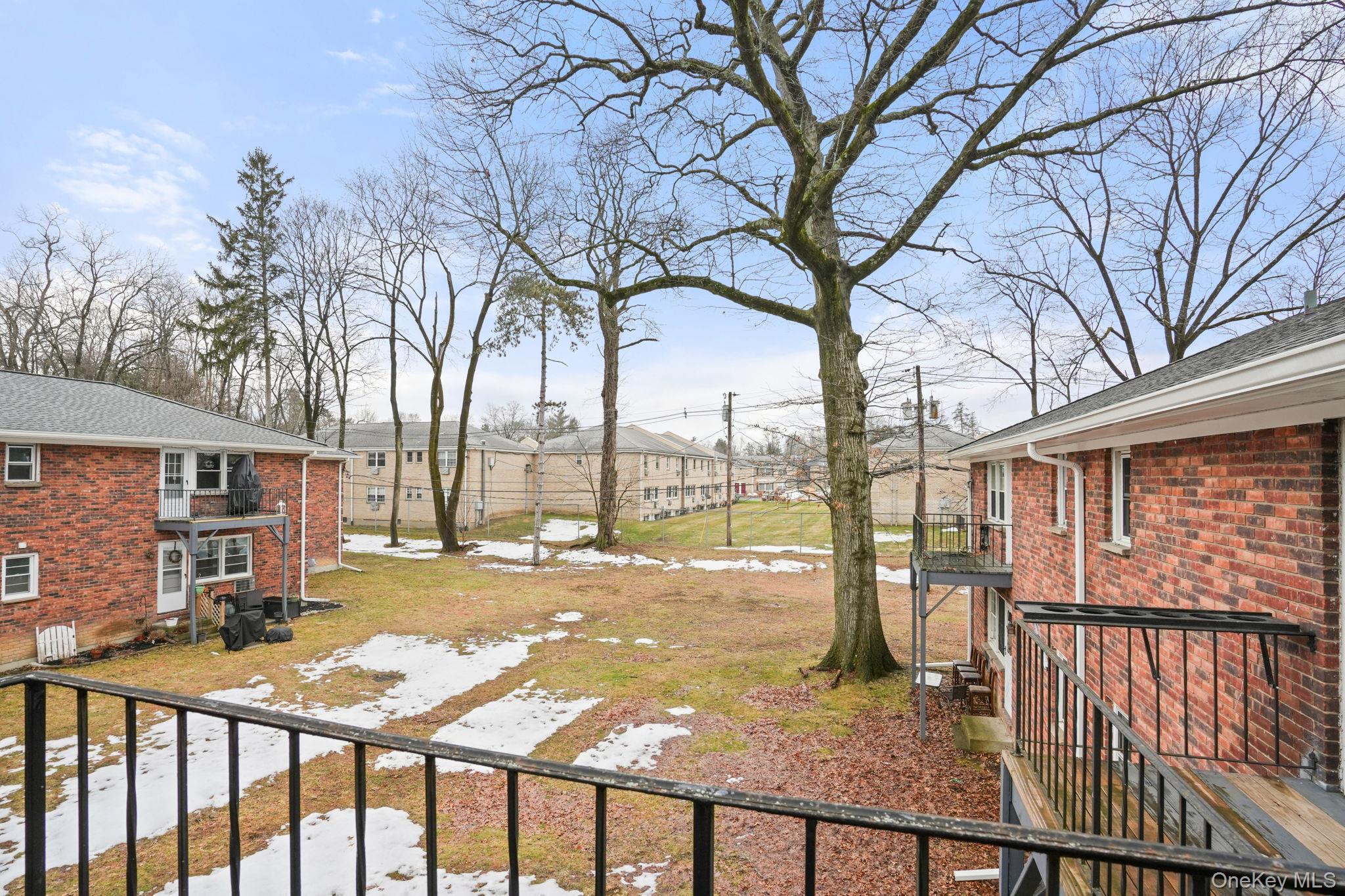 2710 South Road, Unit C6 Poughkeepsie, NY 12601 - Photo 19 of 19 a view of a porch with a yard and wooden fence