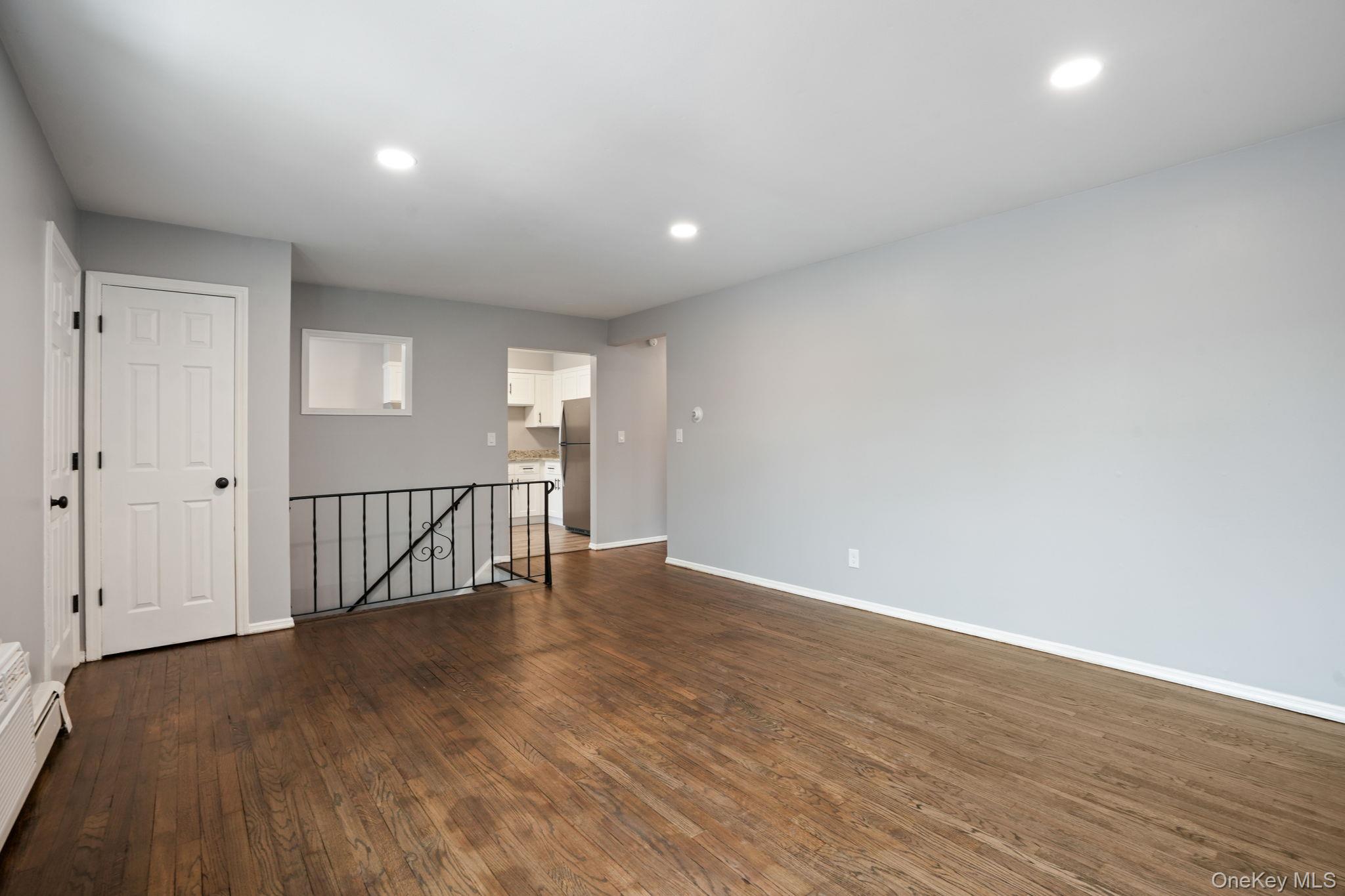 2710 South Road, Unit C6 Poughkeepsie, NY 12601 - Photo 5 of 19 a view of an empty room with wooden floor