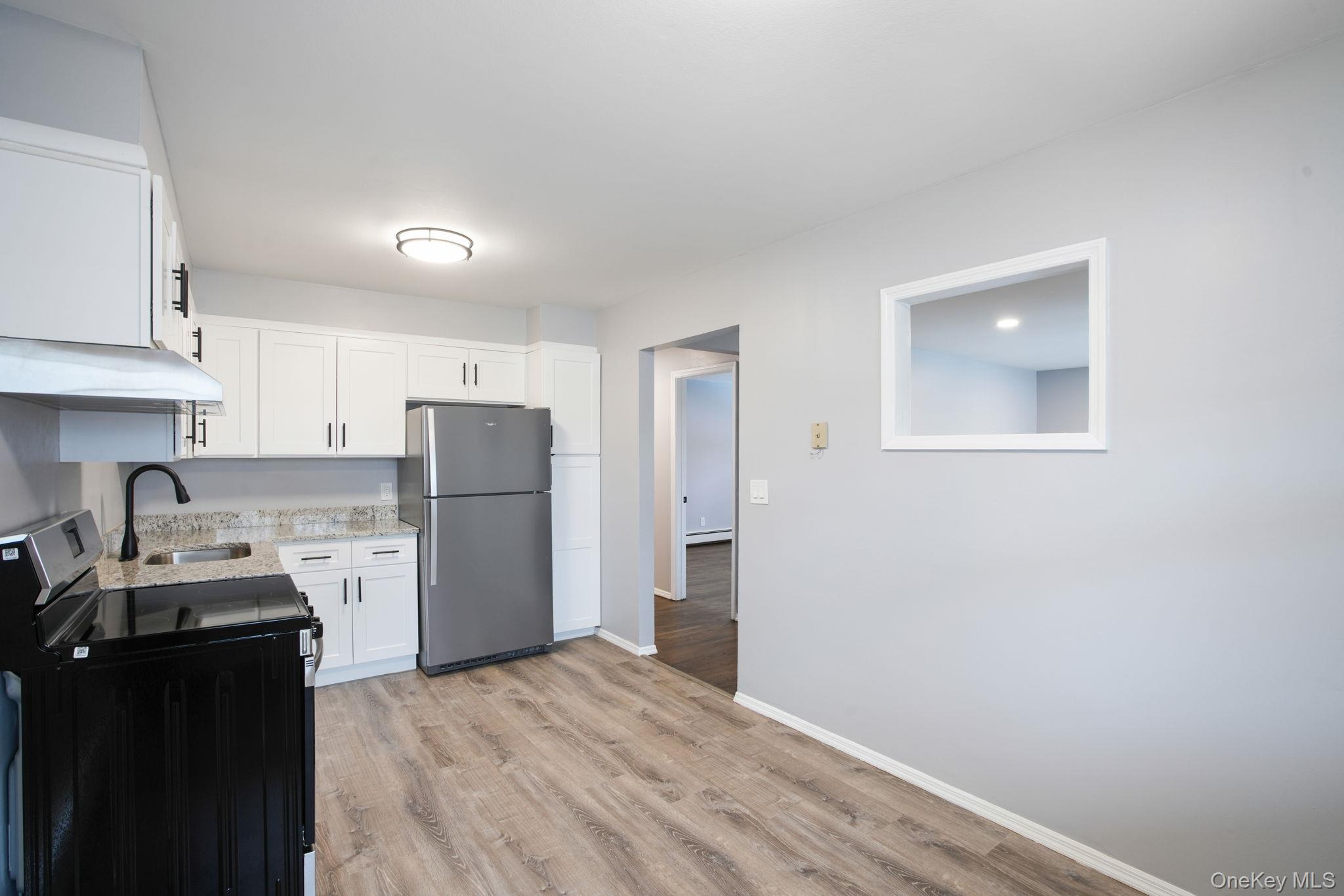 2710 South Road, Unit C6 Poughkeepsie, NY 12601 - Photo 9 of 19 a kitchen with a refrigerator a stove top oven a sink and dishwasher