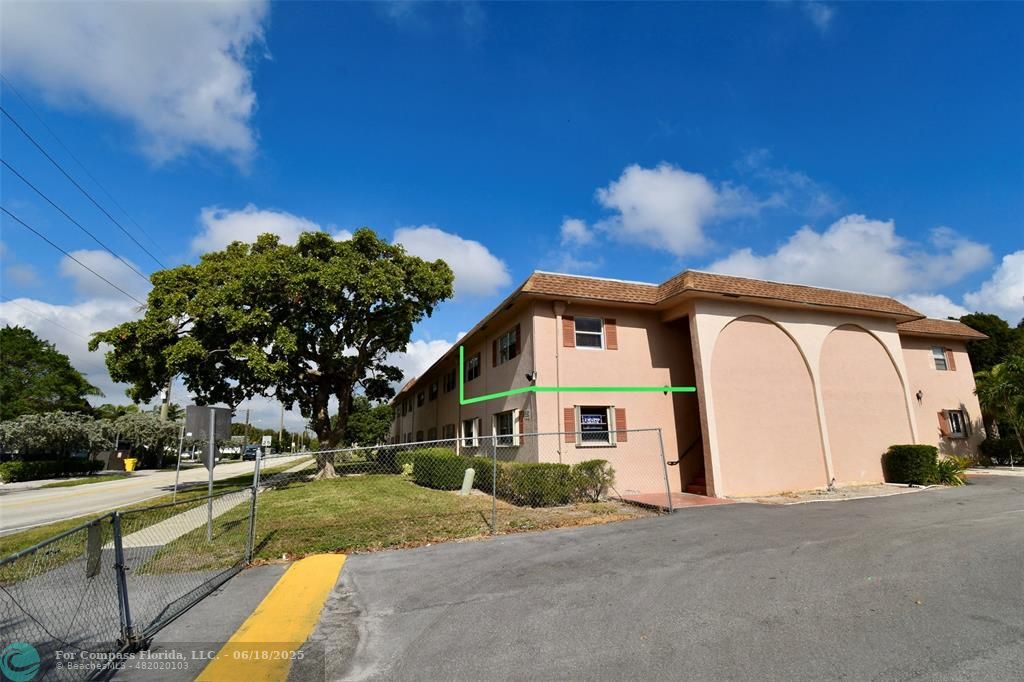650 Southwest 2nd Avenue, Unit 256 Boca Raton, FL 33432 - Photo 2 of 13 a front view of a house with a yard
