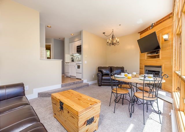 24 River Run Road, Unit 2907 Keystone, CO 80435 - Photo 2 of 37 a living room with furniture and a flat screen tv