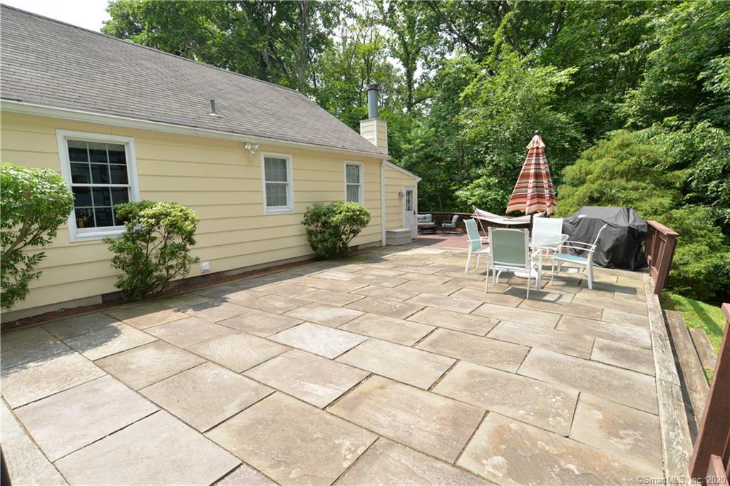 31 Powder Horn Hill Road Wilton, CT 06897 - Photo 12 of 16 a view of a house with backyard and sitting area