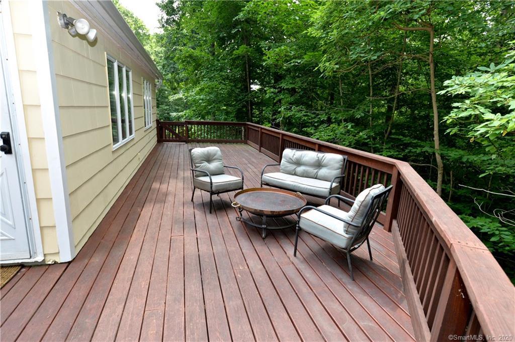31 Powder Horn Hill Road Wilton, CT 06897 - Photo 13 of 16 a view of balcony with wooden floor and outdoor seating