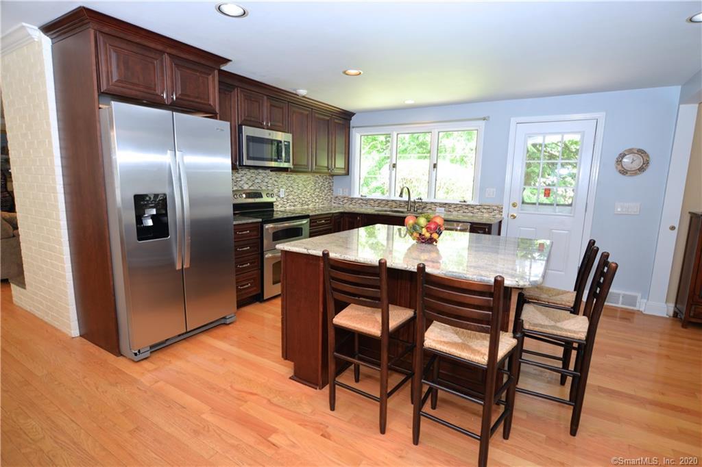 31 Powder Horn Hill Road Wilton, CT 06897 - Photo 2 of 16 a dining room with furniture and window