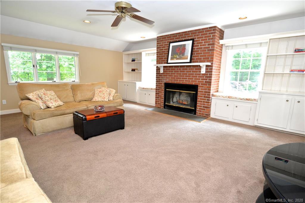 31 Powder Horn Hill Road Wilton, CT 06897 - Photo 3 of 16 a living room with furniture and a fireplace