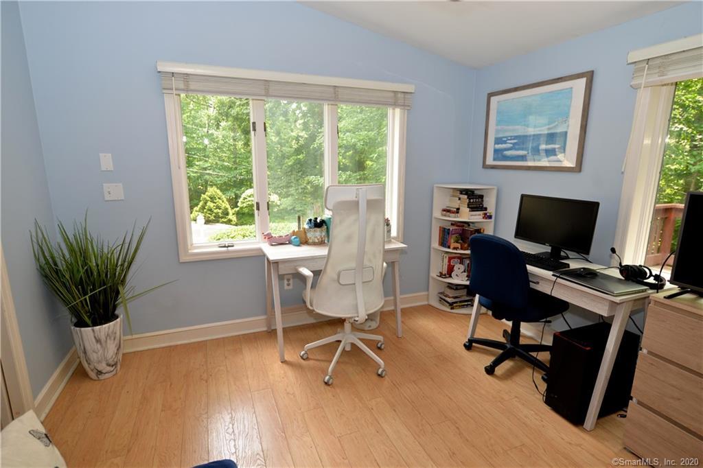 31 Powder Horn Hill Road Wilton, CT 06897 - Photo 5 of 16 a view of a workspace with furniture and a window