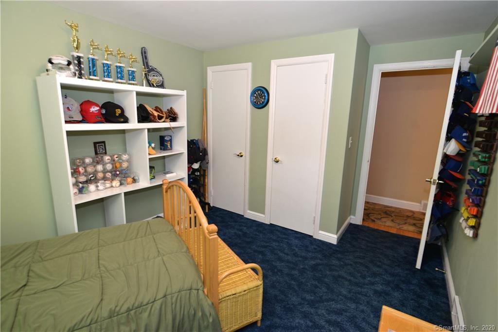 31 Powder Horn Hill Road Wilton, CT 06897 - Photo 8 of 16 a bed room with a bed and a window