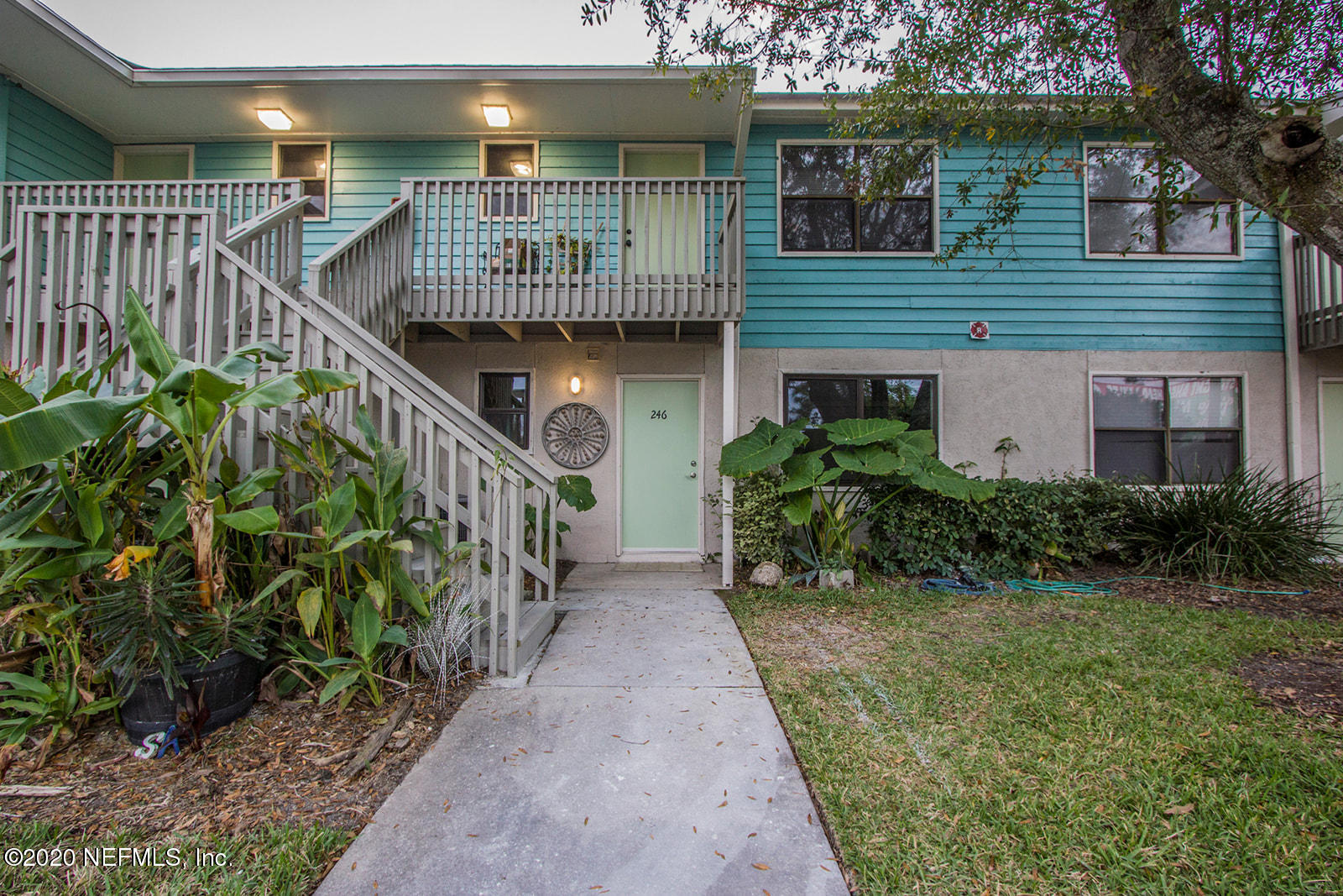 650 Pope Road, Unit 246 St. Augustine, FL 32080 - Photo 1 of 26 a view of a house with brick walls and flower plants