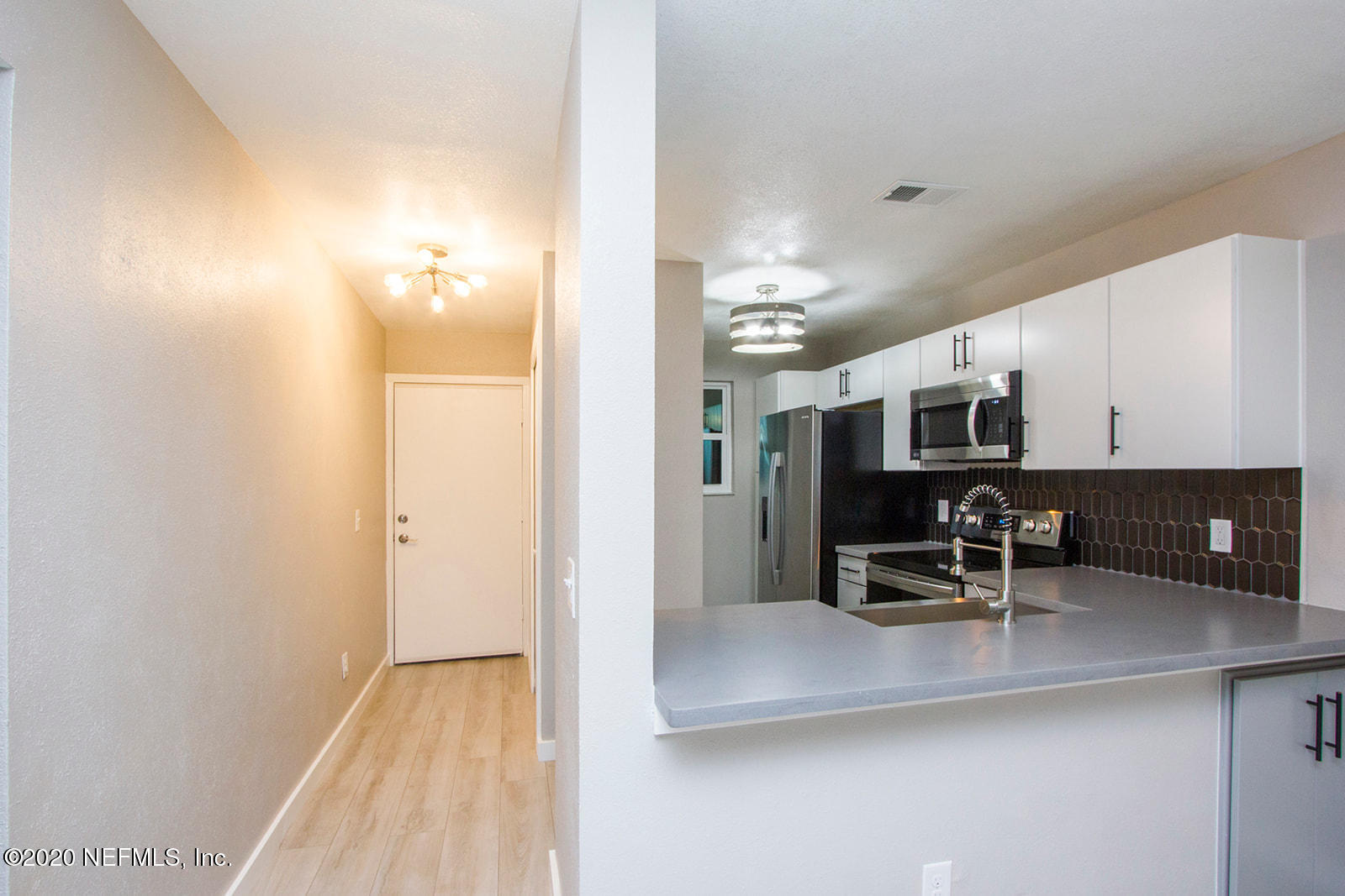 650 Pope Road, Unit 246 St. Augustine, FL 32080 - Photo 3 of 26 a view of kitchen with furniture and counter space