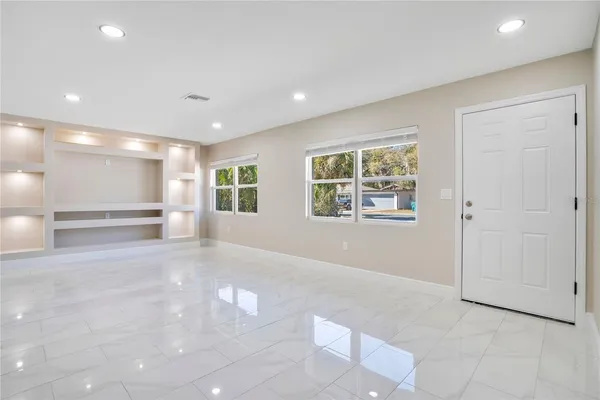 a view of an empty room with a window