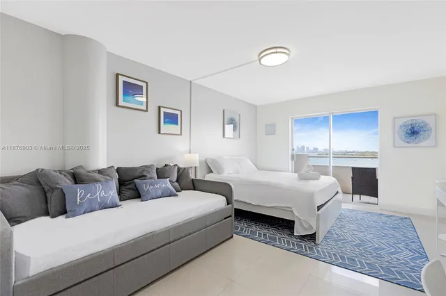 a living room with couches and painting on the wall