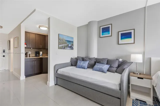 a living room with furniture and a walk in closet