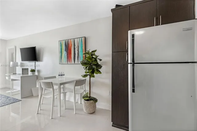 a white refrigerator freezer sitting in a kitchen
