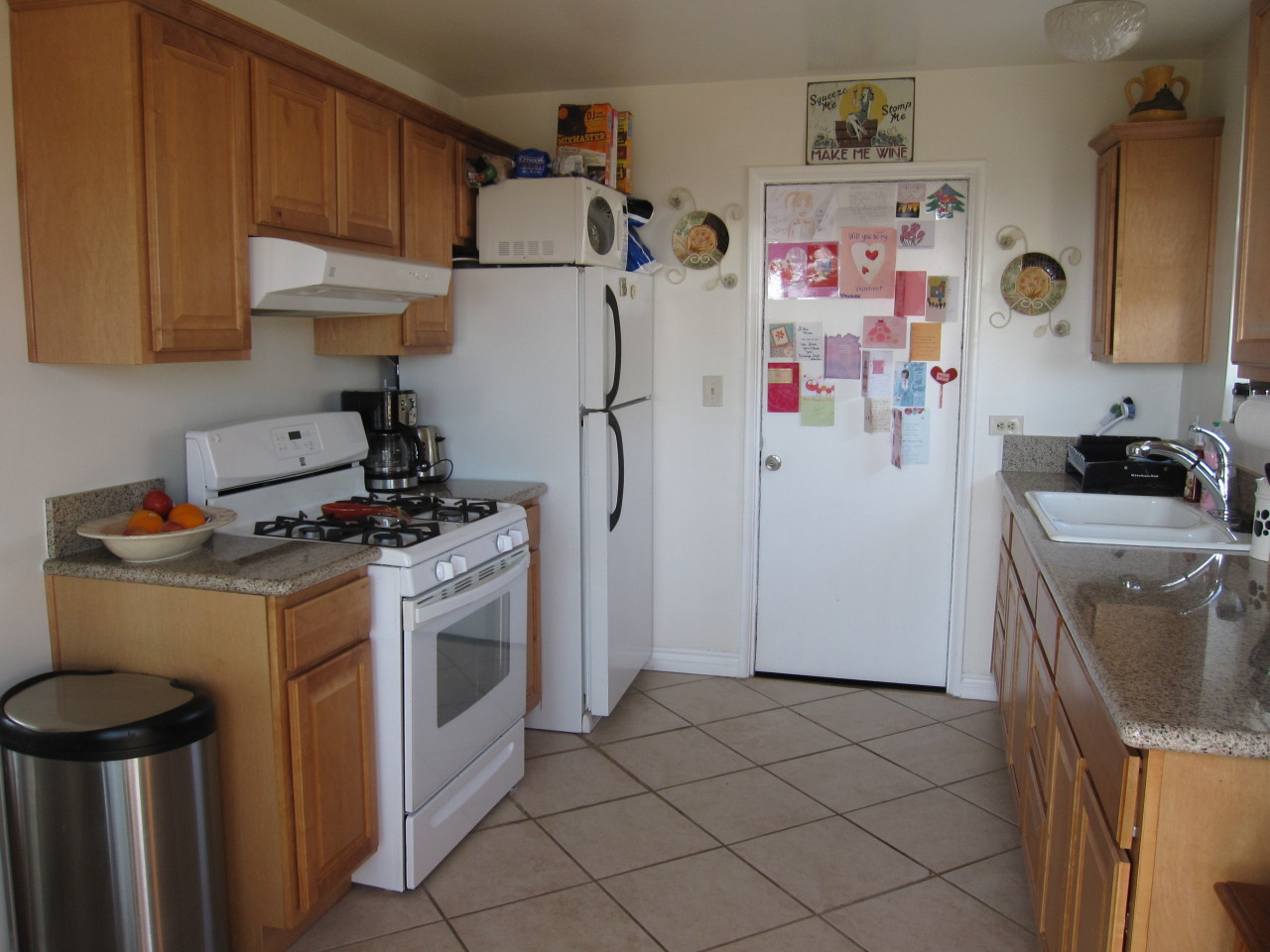 947 Cheltenham Road Santa Barbara, CA 93105 - Photo 26 of 35 a view of a kitchen with fridge and wooden floor