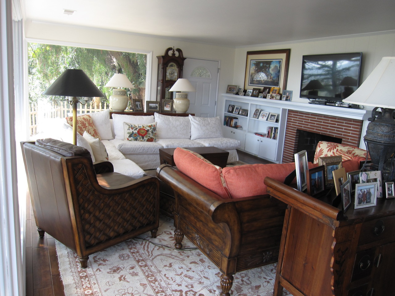 947 Cheltenham Road Santa Barbara, CA 93105 - Photo 8 of 35 a living room with furniture a table and a fireplace