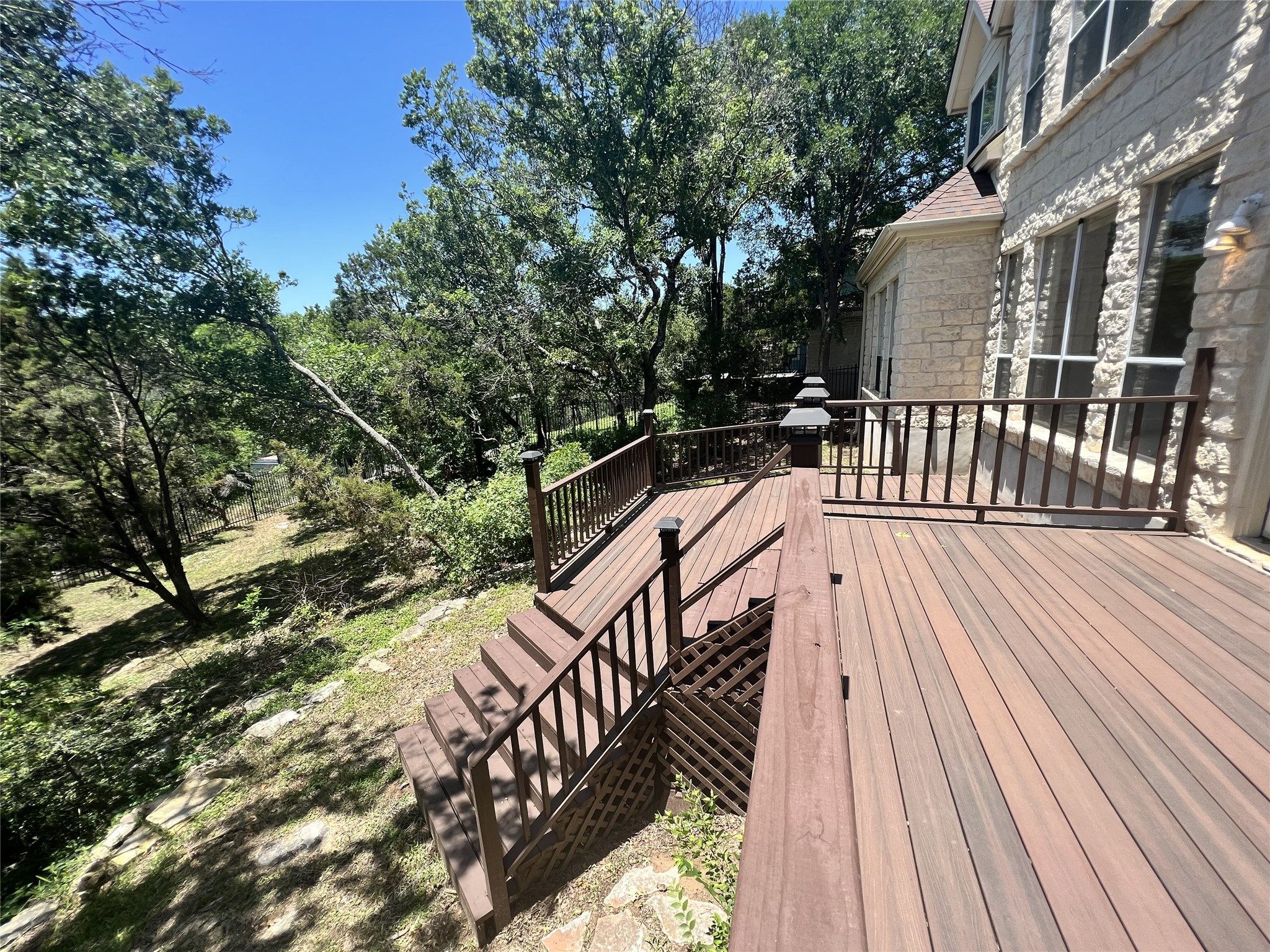 9405 Ashton Ridge Austin, TX 78750 - Photo 20 of 22 A spacious wooden deck provides an elevated outdoor retreat with scenic views.