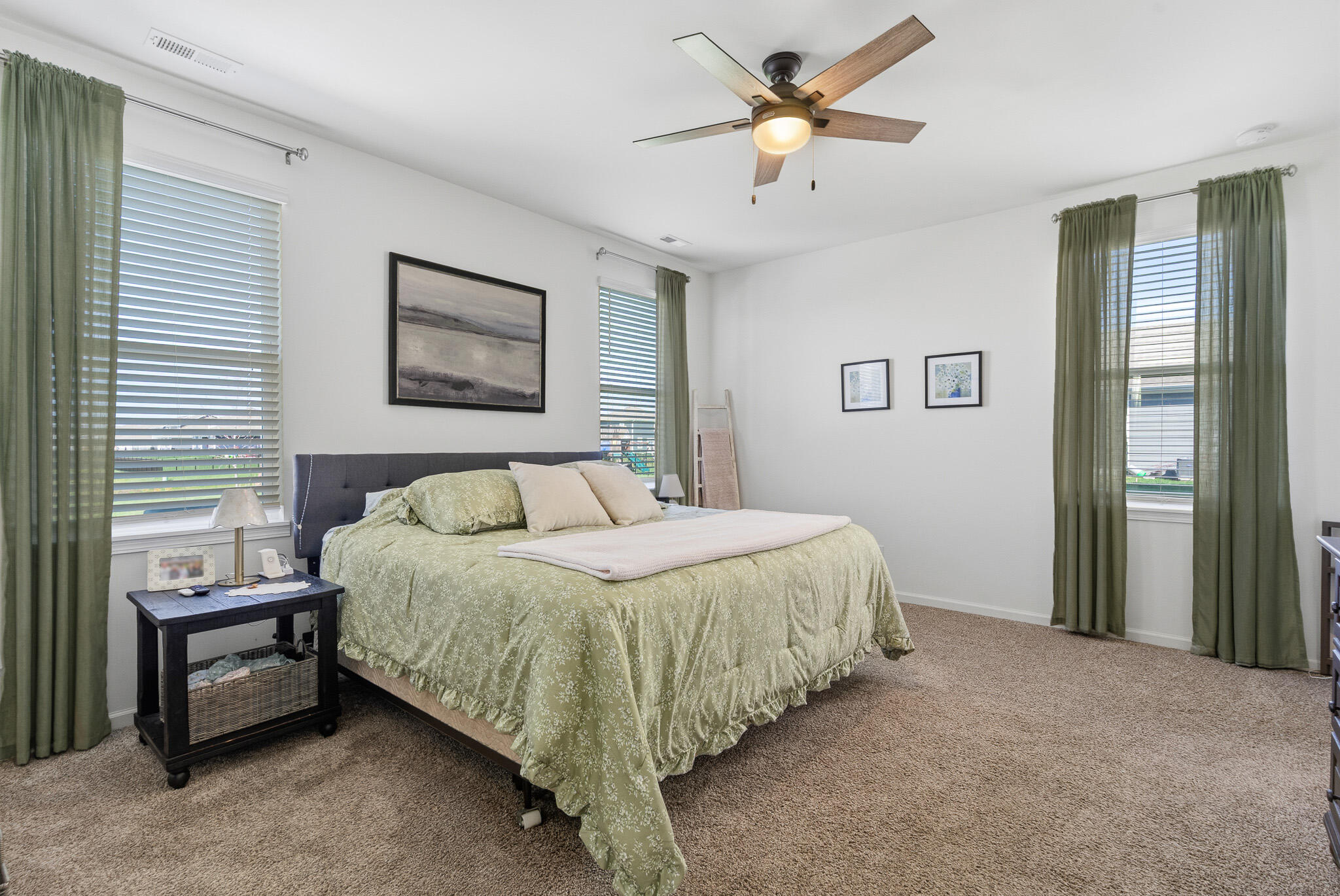 7700 West 105th Avenue Crown Point, IN 46307 - Photo 15 of 39 a bedroom with a bed chandelier and a window
