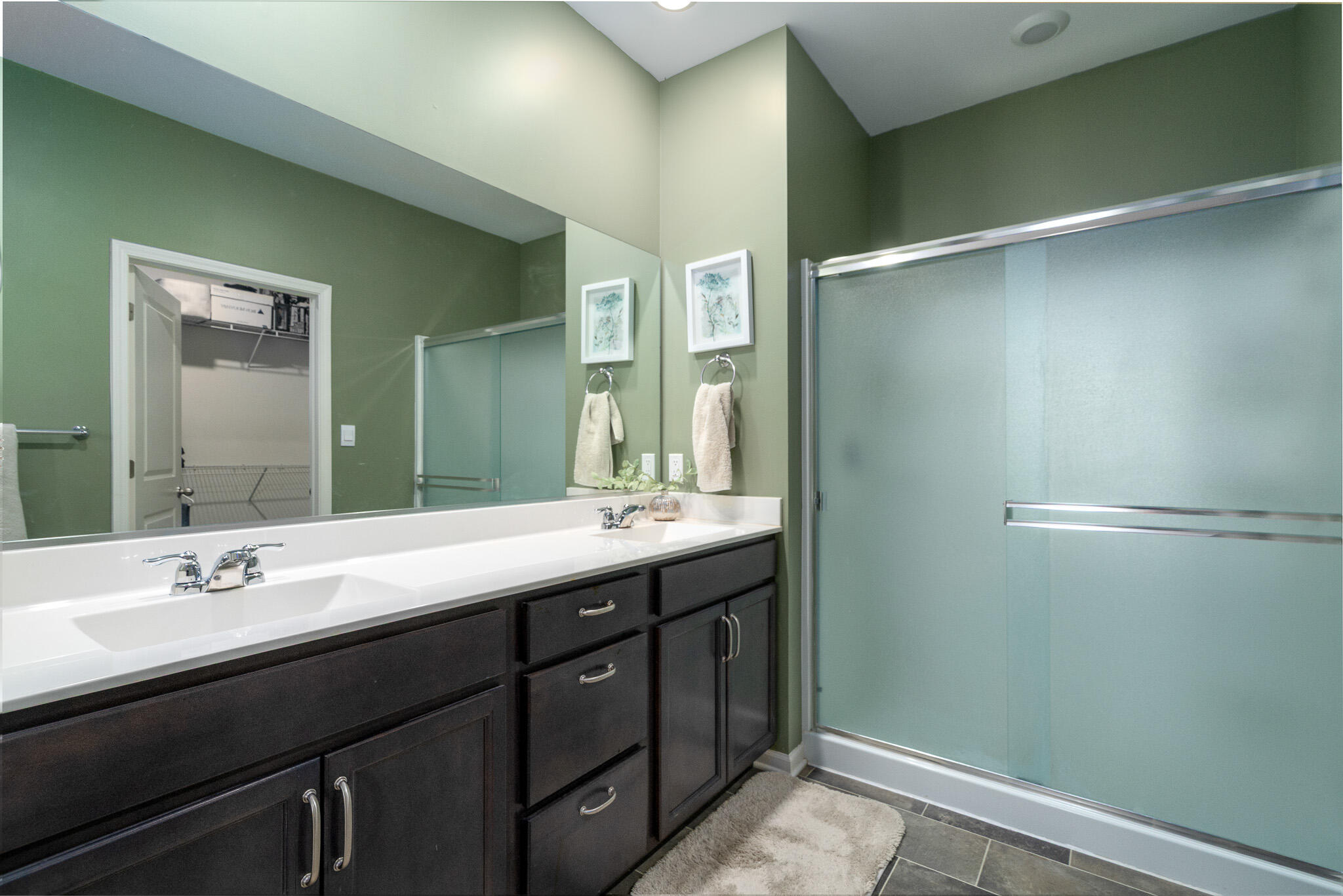 7700 West 105th Avenue Crown Point, IN 46307 - Photo 16 of 39 a bathroom with a double vanity sink and mirror