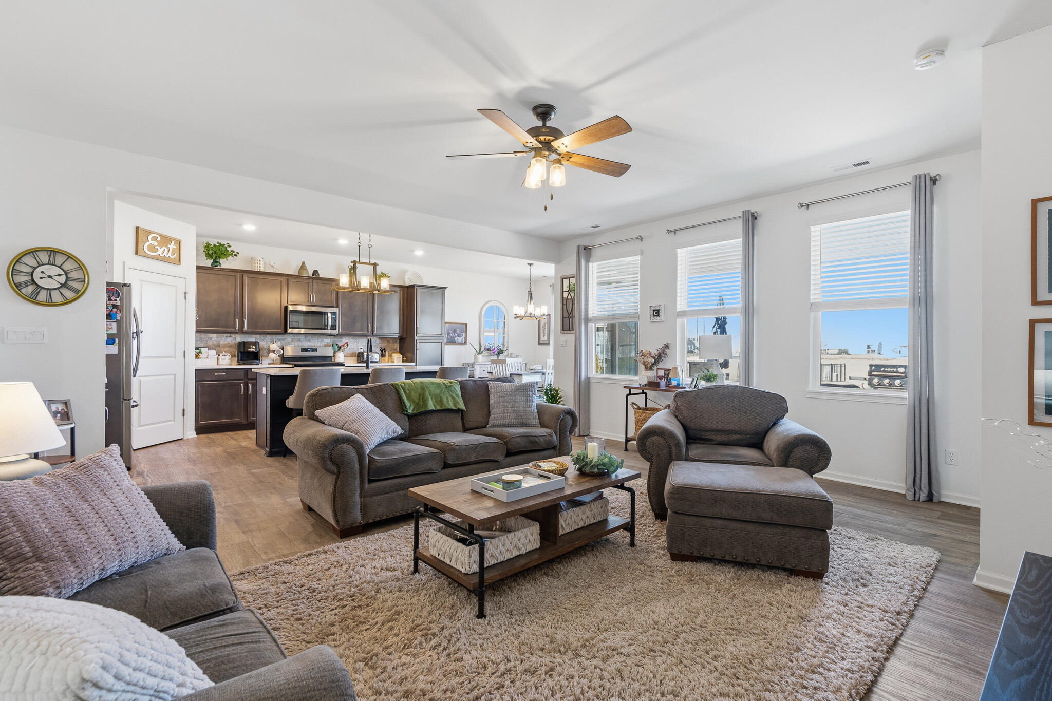 7700 West 105th Avenue Crown Point, IN 46307 - Photo 3 of 39 a living room with furniture kitchen view and a chandelier