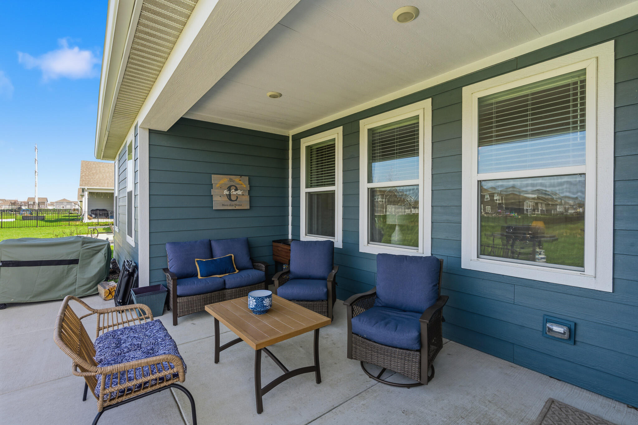 7700 West 105th Avenue Crown Point, IN 46307 - Photo 33 of 39 a outdoor living space with furniture and a window